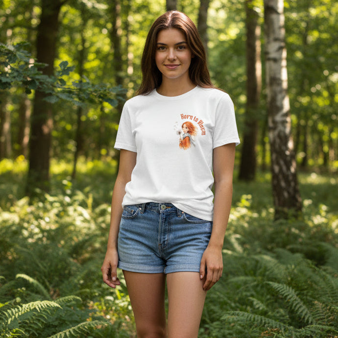 White t-shirt with a graphic design of a girl with red hair and text 'Born to Bloom' on a white background.