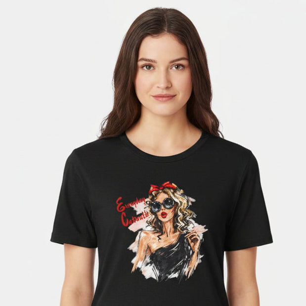 Black t-shirt with a graphic of a woman wearing sunglasses and a red bow on a white background