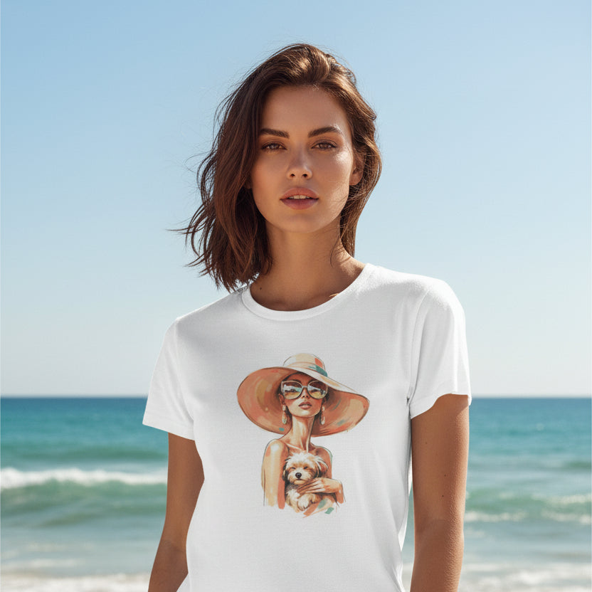 White t-shirt with a graphic of a woman in a hat holding a dog on a white background