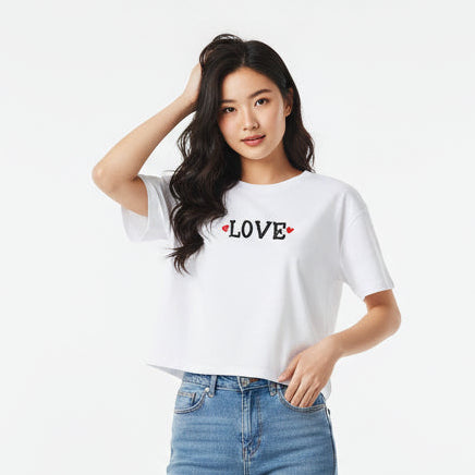 White t-shirt with 'LOVE' printed on a white background
