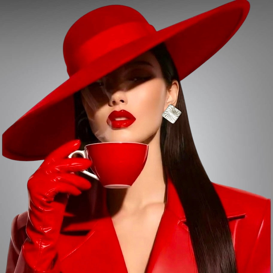 Woman in a red outfit resin square earring with a large red hat. Mehrartcollections 